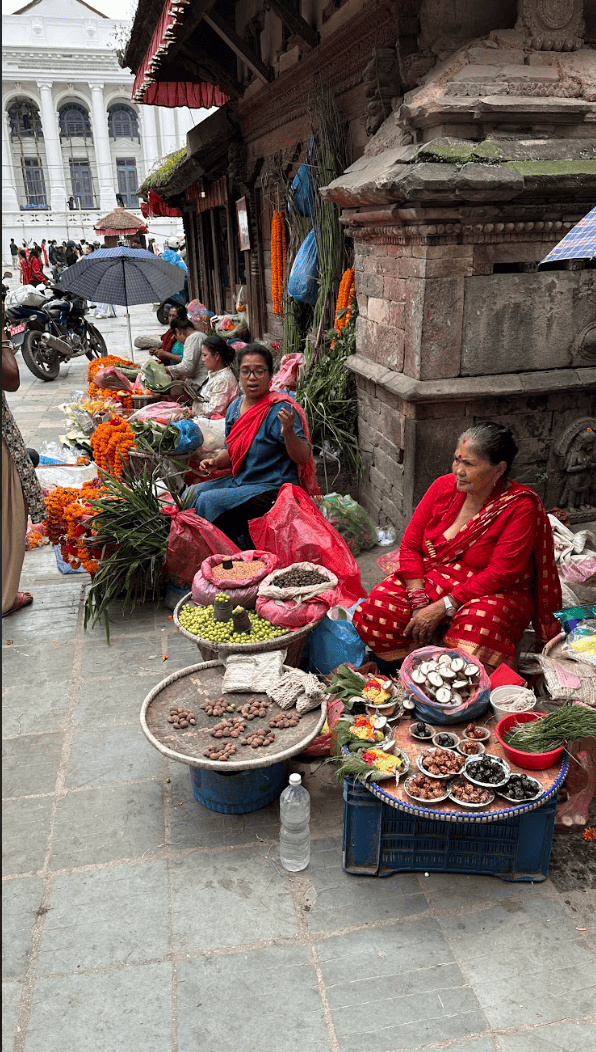 Women selling garland outside temple in kathmandu